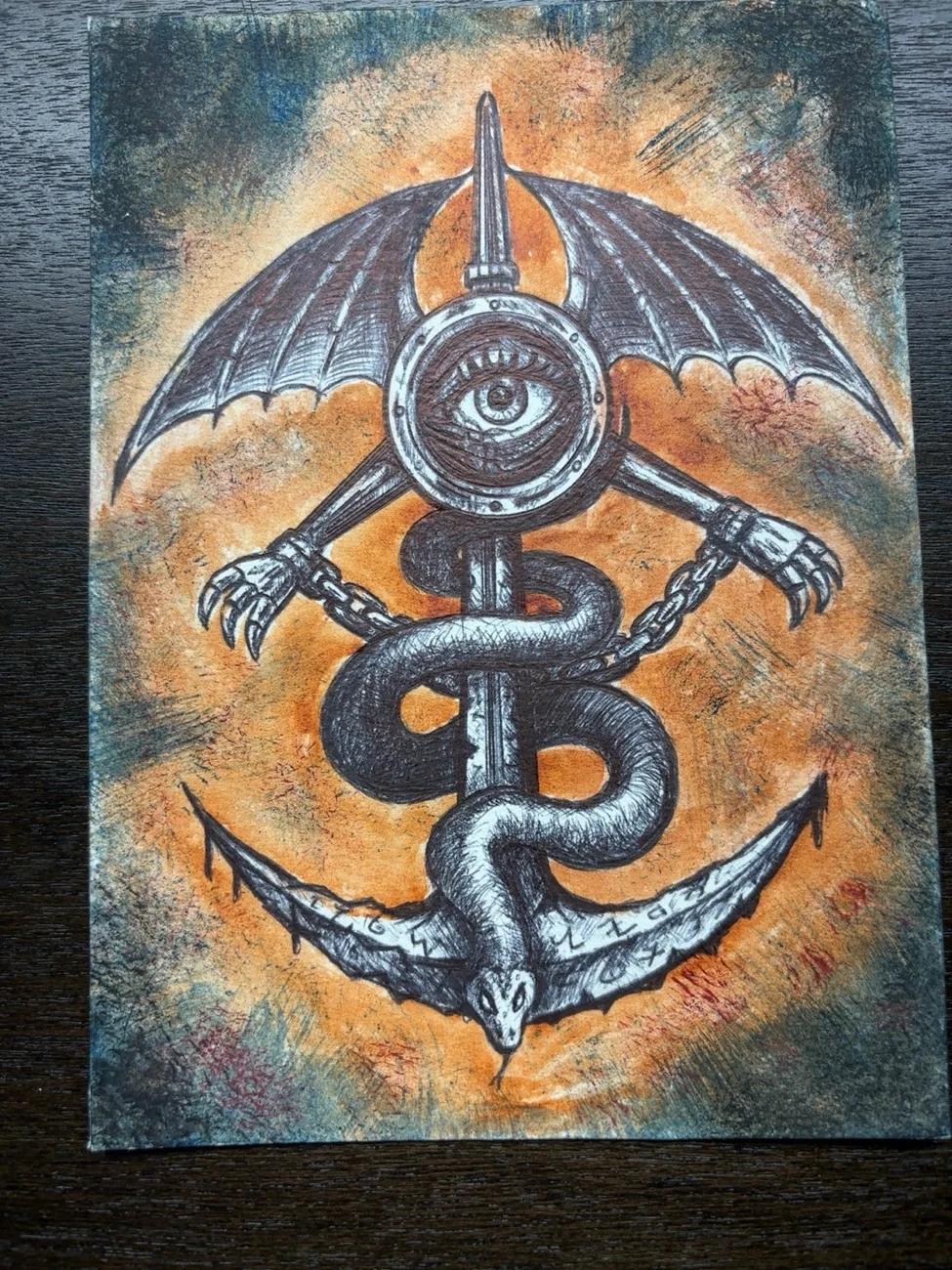 Original colorful winged eye-and-serpent symbol