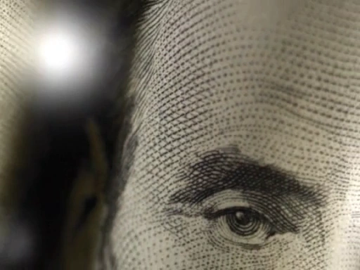 Close-up of engraved currency portrait from Cash Management commercial