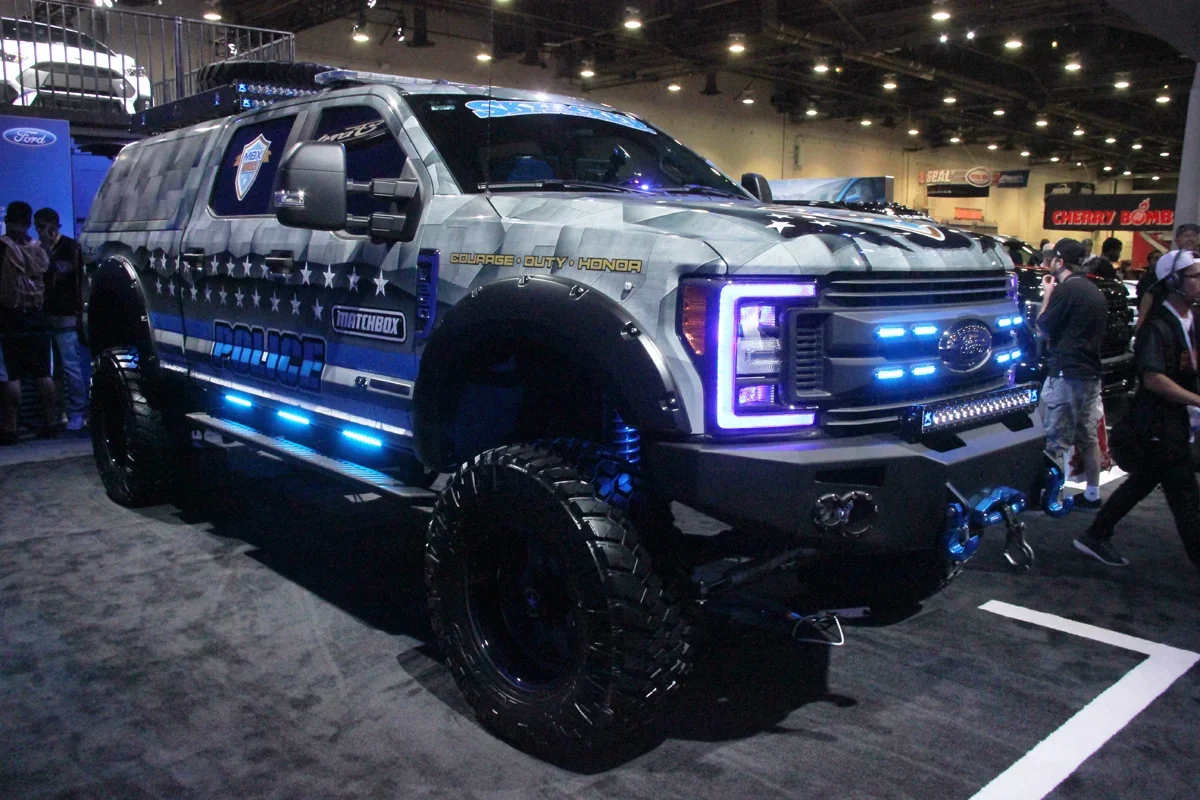 Gray police-themed Ford Super Duty branded with Skyjacker, Matchbox and MBX350 at SEMA
