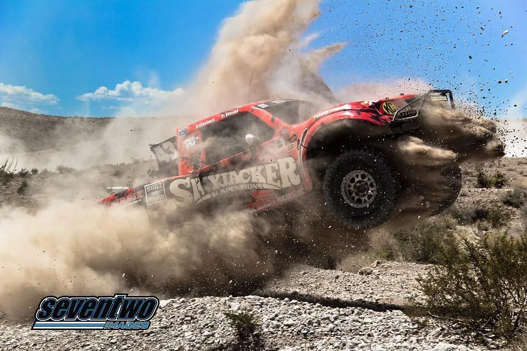 Skyjacker race truck kicking up a huge cloud of desert dust, Seventwo Images photo